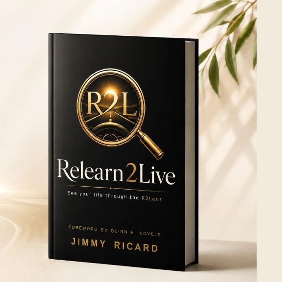 Relearn2Live book on a studio set with a golden road horizon